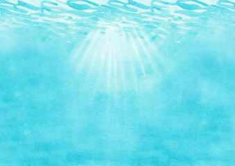 Sunbeams under the rippled ocean water surface