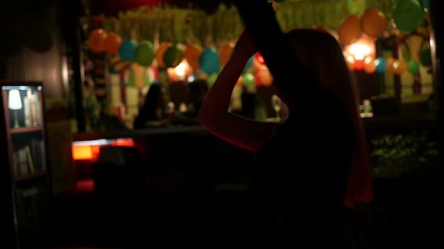 Close up girlfriends dancing in nightclub, young women dance
