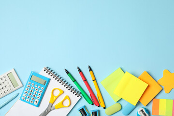 Different stationery on light blue background, flat lay with space for text. Back to school