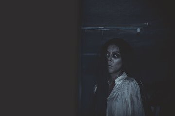 Portrait of asian woman make up ghost face,Horror scene,Scary background,Halloween poster