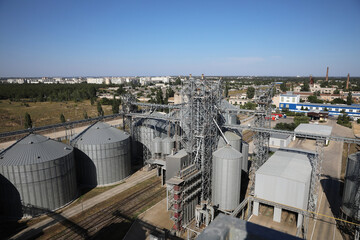 Fototapeta na wymiar View of modern granaries for storing cereal grains outdoors