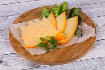 Sliced yellow Swiss cheese