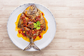 Deep fried pomfret fish and chili sauce