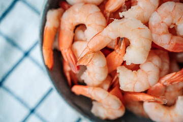 Peeled shrimps in a bowl, macro view