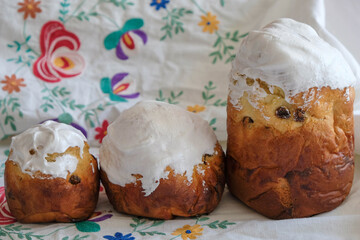 Easter pastries on an embroidered towel. Morning light.