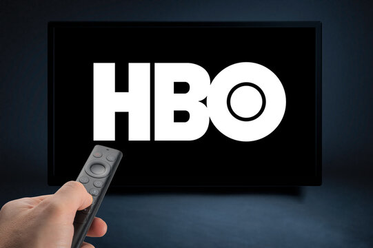 USA, NEW YORK February 2, 2021: Close up of Nvidia Sheild TV Remote in Hand and TV Screen with HBO Logo, HBO is a well known global provider of streaming movies