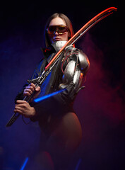 Cybernetic female assassin with sunglasses dressed in black jacket holding a glowing sword. Futuristic martial woman with short haircut posing in dark background.