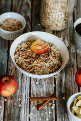 A porridge bowl with apples and cinnamon, food still life, healthy breakfast