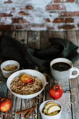 A porridge bowl with apples and cinnamon, food still life, healthy breakfast