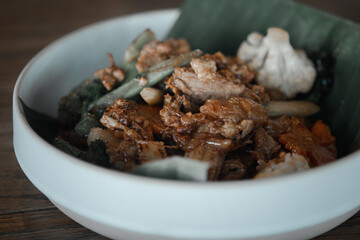 Stir fried rice noodle with soy sauce. It’s called “Pad See Ew” in Thai language.