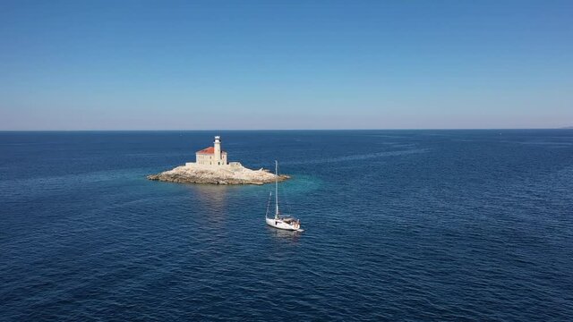 Aerial View of Boat and Lighthouse on Small Island in Adriatic Sea, Croatia