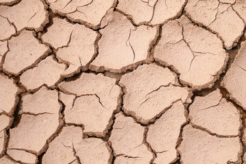 Mudlands that previously contained water have cracked due to hot weather and drought. All water content has been evaporated by the heat