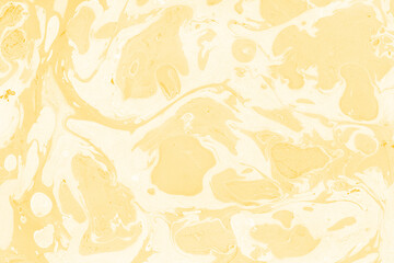 Yellow luxury marble ink texture on watercolor paper background. Marble stone image. Bath bomb effect. Psychedelic biomorphic art.