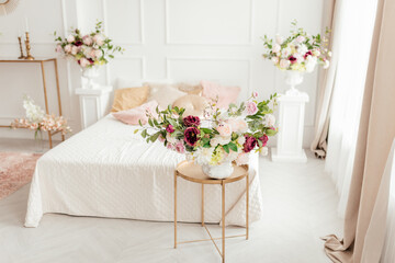 wedding bouquet on a table in bedroom, Beautiful bouquet of colorful flowers in interior of bed room