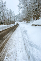 The road covered by the snow of Brallo road pass (Lombardy, Northern Italy, Pavia Province). Is a small village in the hilly area of Oltrepo Pavese, along the road pass between Lombardy and Liguria.