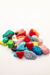 Colorful chocolate candy stones on white background