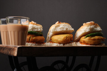 Masala cutting chai and Bombay vada paav is an indian burger. Potato patty is deep fried in gram flour or besan batter it is served hot with paav or bun like sandwich. 