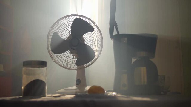 Fan running near a coffee maker
