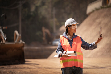 Two Surveyor builder Engineer technician  Business Team discuss plan at new construction site. High...