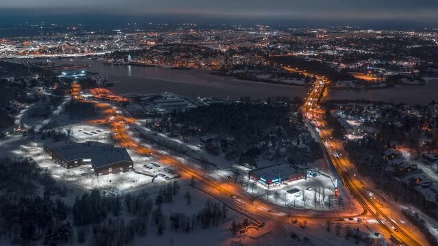 Aerial timelapse of city traffic in a winter morning