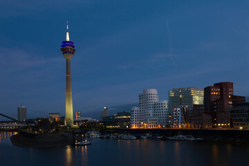 Fototapeta na wymiar Media harbor with Rheinturm tower at night in Dusseldorf, Germany