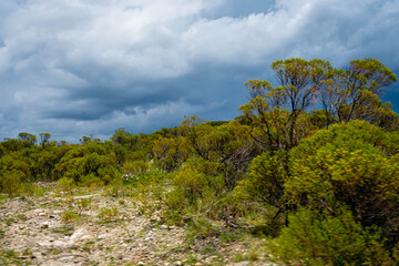 Argentine gravel and dirt routes between countryside landscapes mountains and mountains of Cordoba Argentina in the vicinity of Characato in summer