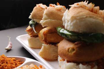 Bombay vada paav is an indian burger. Potato patty is deep fried in gram flour or besan batter and it is served hot with paav or bun like sandwich. Its available and liked all over India