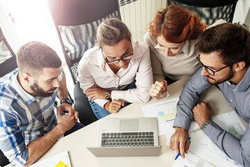Group of designers and programmers starting a new project at the office.	
