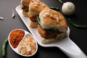 Bombay vada paav is an indian burger. Potato patty is deep fried in gram flour or besan batter and it is served hot with paav or bun like sandwich. Its available and liked all over India