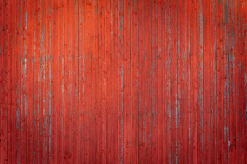 Red barn wall in the evening sun. - obrazy, fototapety, plakaty