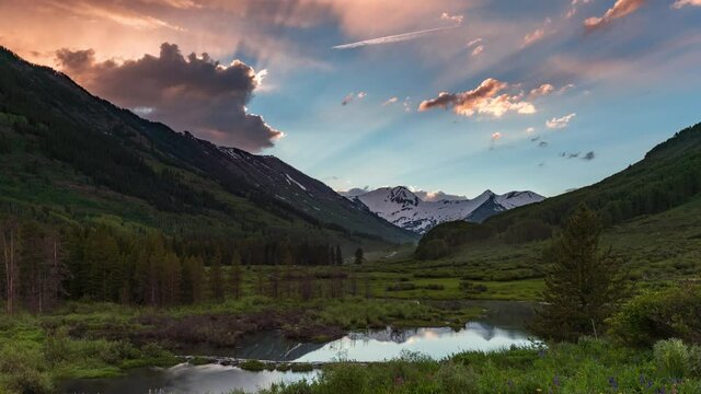 Sunset timelapse of clouds moving over a mountain valley near Crested Butte, Colorado, USA