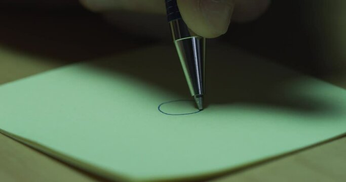 Handwritten smiley face on a sticky note for positivity
