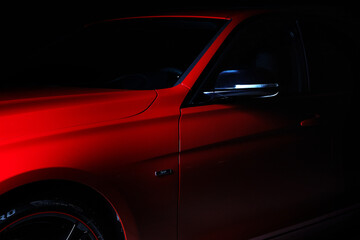 Fototapeta na wymiar Red Sports Car in Dark