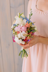 Bouquet of Violet-pink carnations and Shabo carnations a gift to a young woman on Women's Day in March