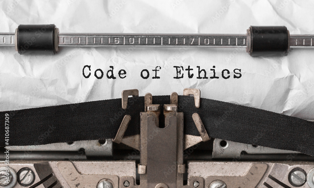 Poster text code of ethics typed on retro typewriter