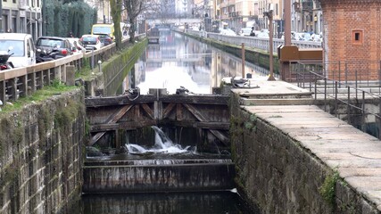 Europe, Italy , Milan February 2021 -  Leonardo Da Vinci closed water dam construction in Navigli Canals during Covid-19 Coronavirus lockdown - downtown empty of tourists 