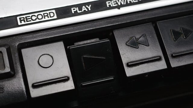 Pressing Play Button On An Black Retro Cassette Tape Recorder.
