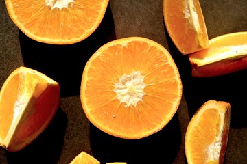 Fresh orange slices oranges. Orange composition on a dark background.