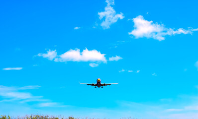 Fototapeta na wymiar airplane Landing at Phuket International airport in sunny day