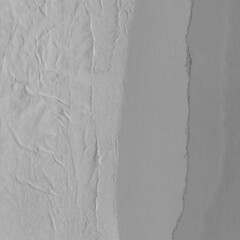  White torn paper collage close-up. Texture made from various paper and cardboard parts. Damaged old paper background. Vintage blank wallpaper. Material design backdrop.