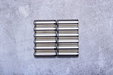Batteries energy equipment on gray concrete background, top view space for text