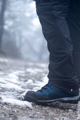 Snow boots on the mountain with foggy background