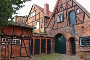 Lüneburg, Germany: In the courtyard of the historic building „Hospital zum Roten Hahn“, a former refuge for poor and sick people, 15th century. Now a residential building for artists. Europe.