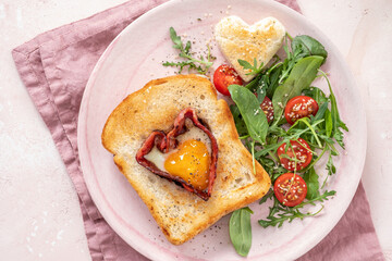 Egg in a hole of bread heart shape for Valentines day breakfast