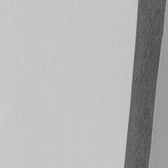 White torn paper collage close-up. Texture made from various paper and cardboard parts. Damaged old paper background. Vintage blank wallpaper. Material design backdrop.