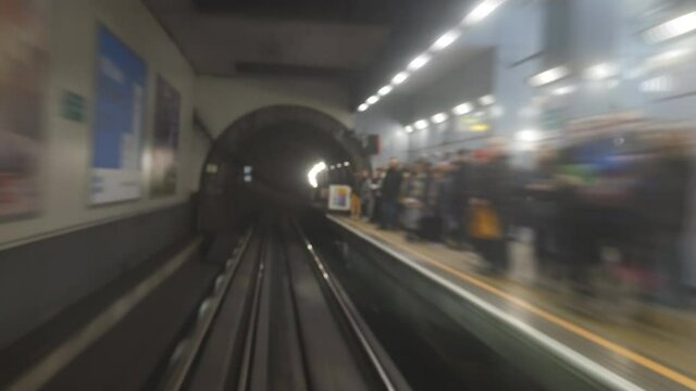 Time lapse. A view from inside a moving train in the underground.
