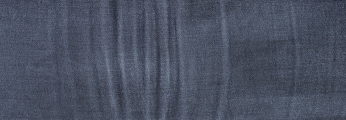 texture of dark blue jeans denim fabric background