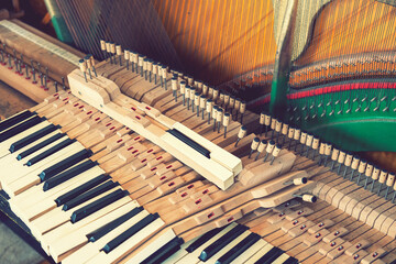 Setting up an old piano. The master repairs an old piano. Deep cleaning the piano. Hands of...
