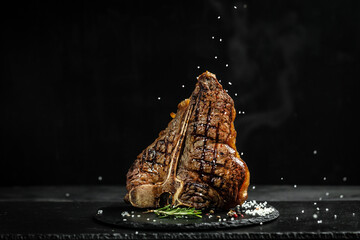 The T-bone or porterhouse steak of beef cut from the short loin. steaksT-shaped bone with meat on...