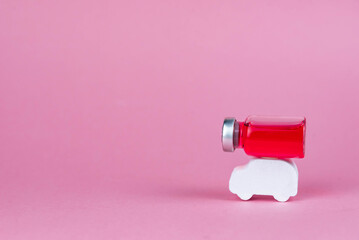 Vaccine transportation concept. Shipping of virus treatment. Medical glass vials and syringe for vaccination. Pharmacy delivery.